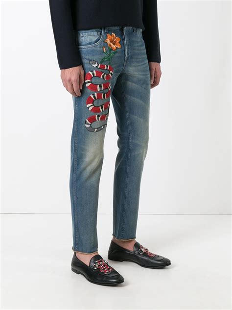 gucci snake jeans